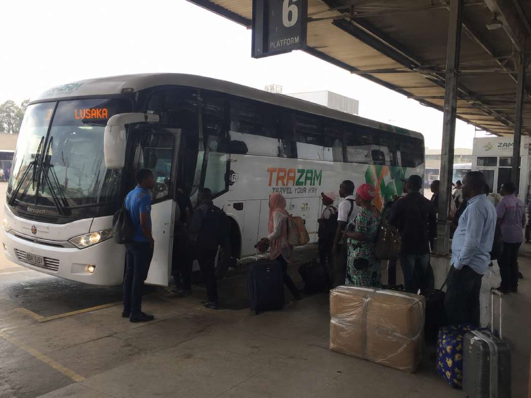 Boarding an onward bus after flying into Lusaka